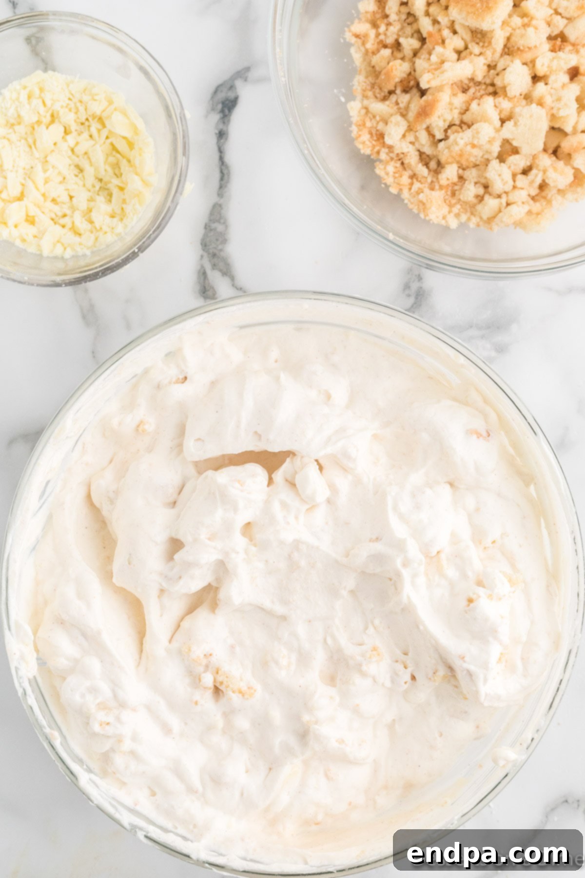 Merry Melts 9 The finished ice cream mixture, fully combined with cookies and chocolate, ready for layering.