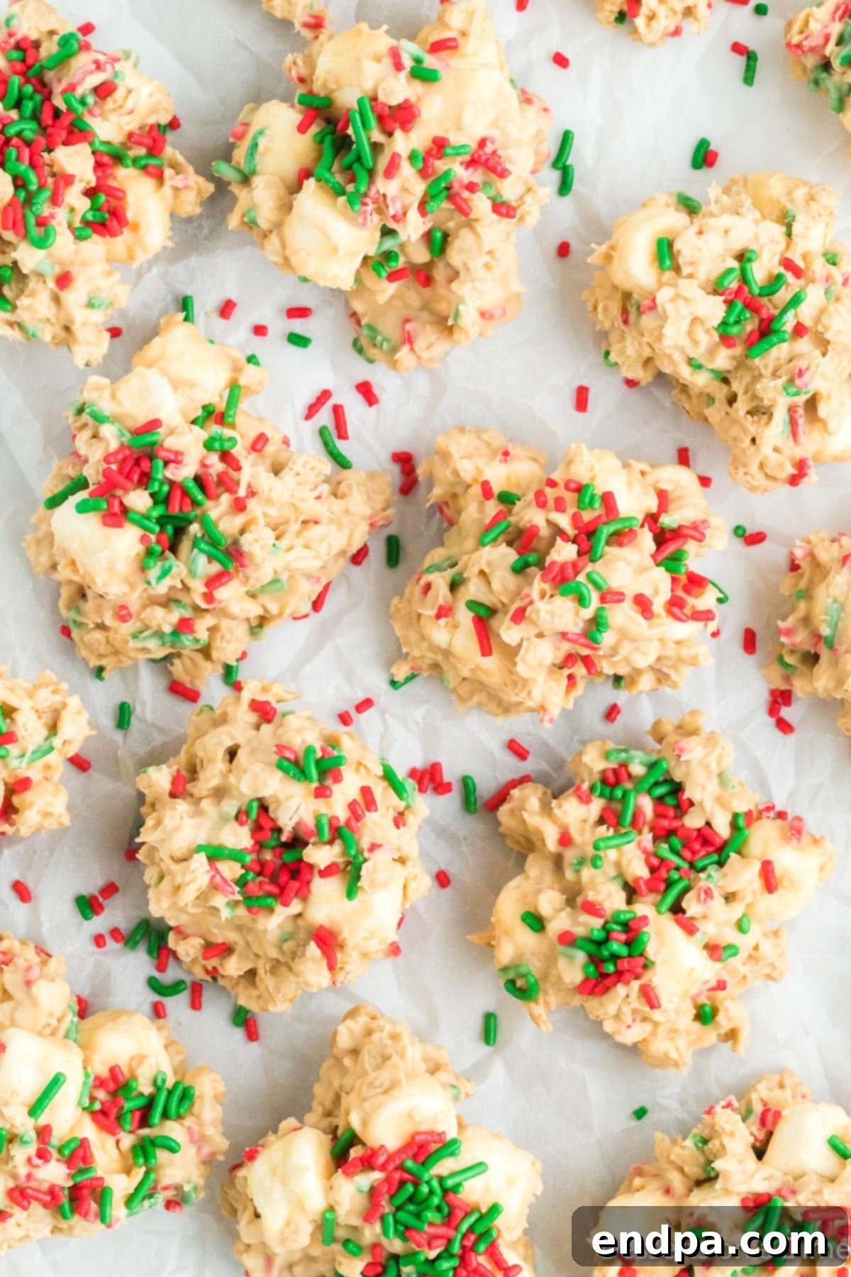 Festive No-Bake Delights 8 A festive platter of Christmas No Bake Cookies, generously topped with red and green Jimmie sprinkles.