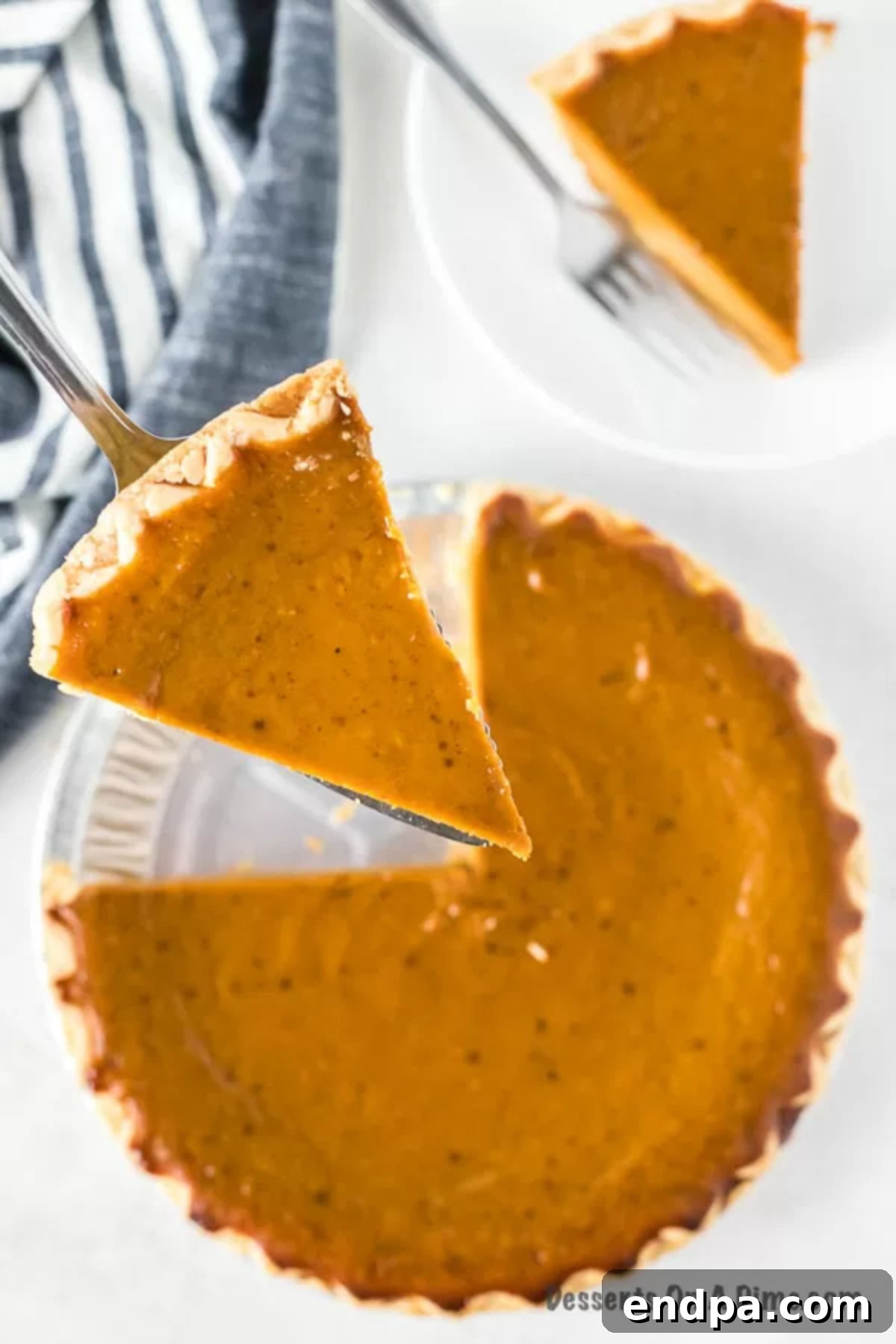 Slice of pumpkin pie being served.