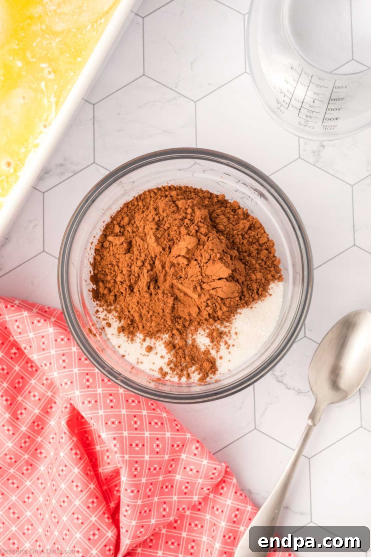 Combining the sugar and cocoa powder