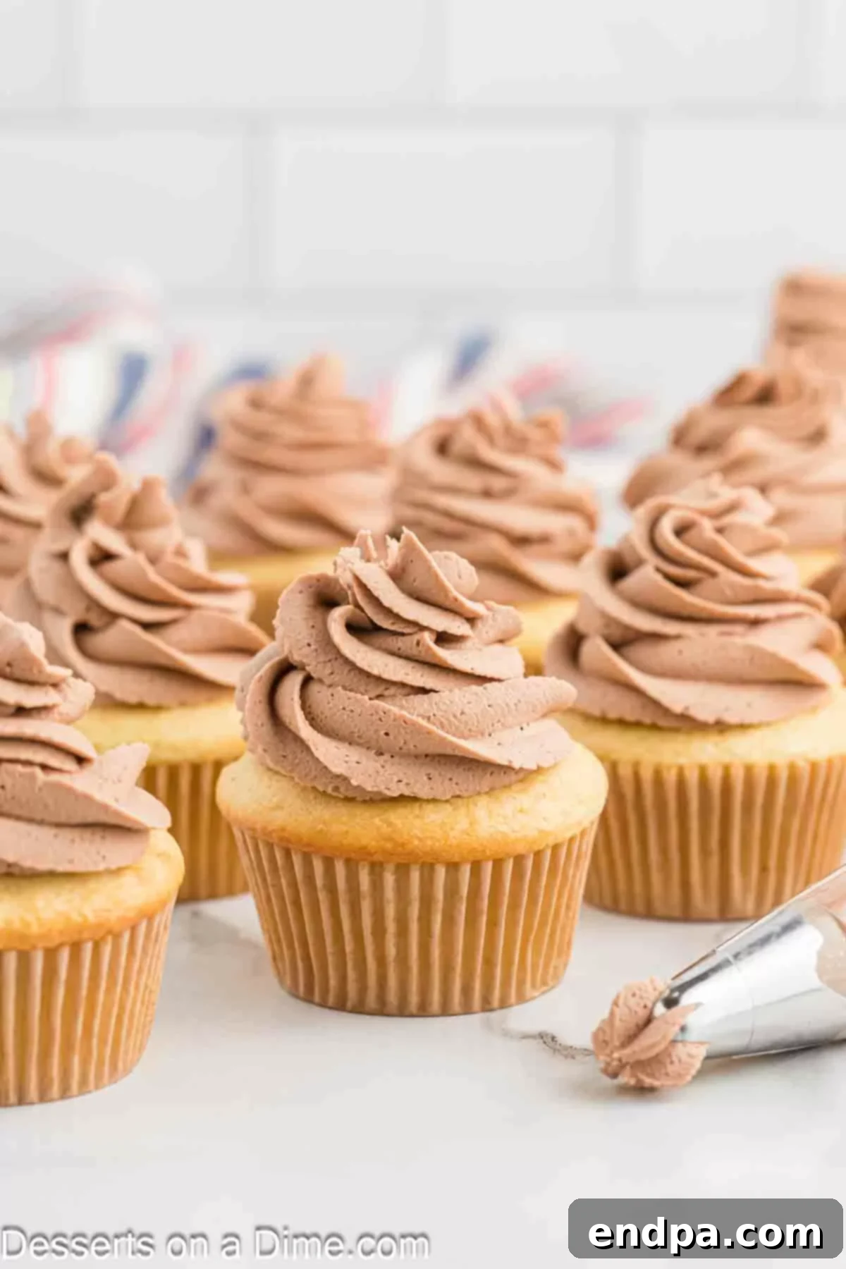 Whipped Nutella Delight 8 A close-up of beautifully piped Nutella frosting on cupcakes, showcasing its creamy texture.
