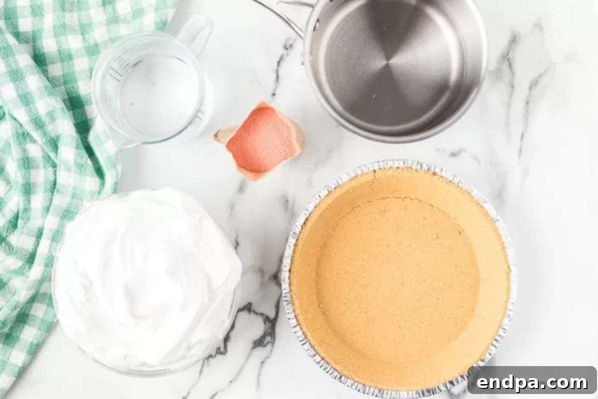 Ingredients needed: water, strawberry jello mix, cool whip, and a graham cracker crust