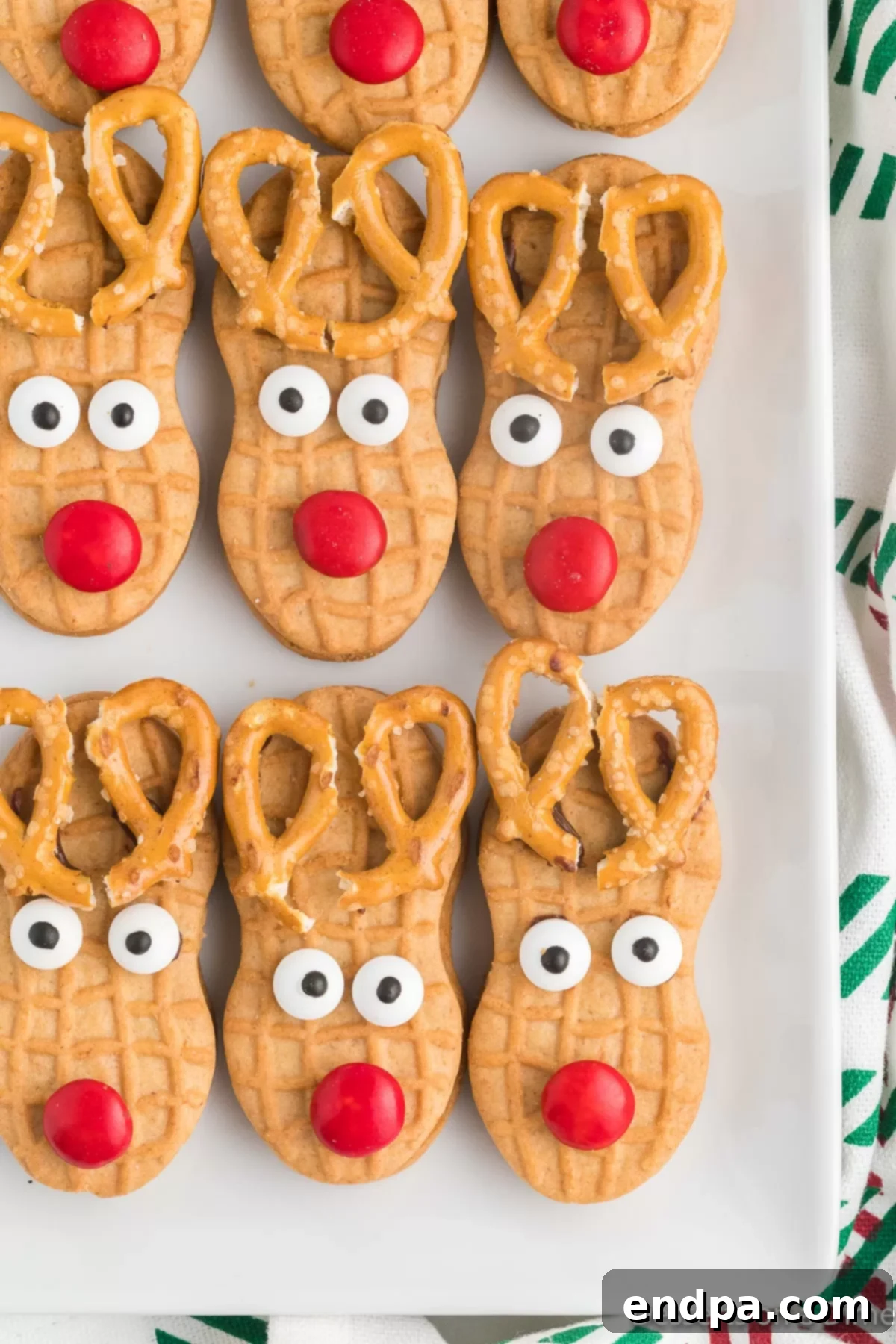 A festive platter of Nutter Butter Reindeer cookies, perfectly decorated for the holidays.