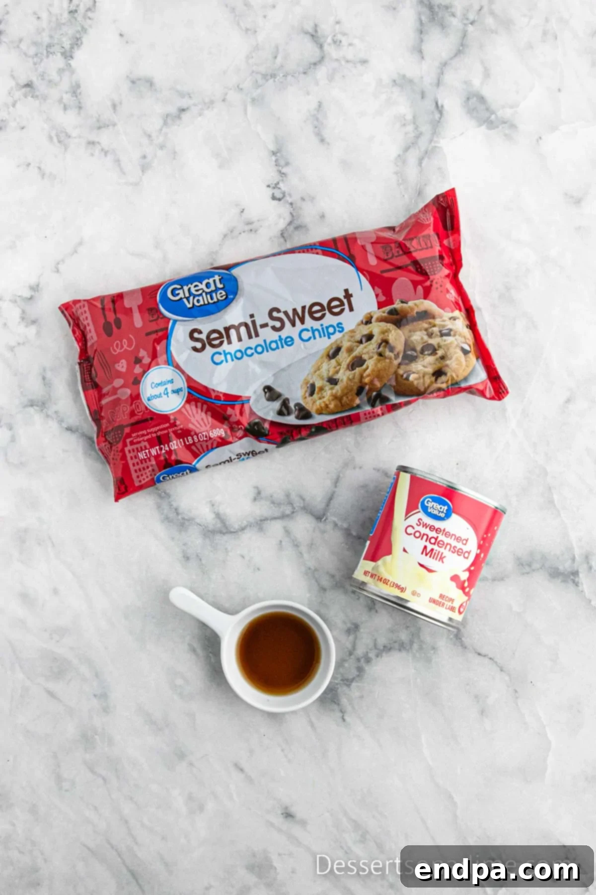 Ingredients for Crock Pot Fudge laid out: sweetened condensed milk, chocolate chips, vanilla extract.