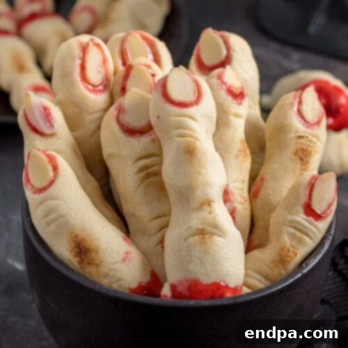 Wickedly Wonderful Halloween Cookie Ideas 20 Creepy Witch Finger Cookies with buttery base, strawberry jam, and sliced almonds