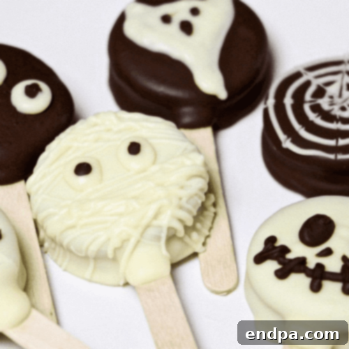 Wickedly Wonderful Halloween Cookie Ideas 33 Halloween Oreo Pops made with Oreo cookies, white and dark chocolate