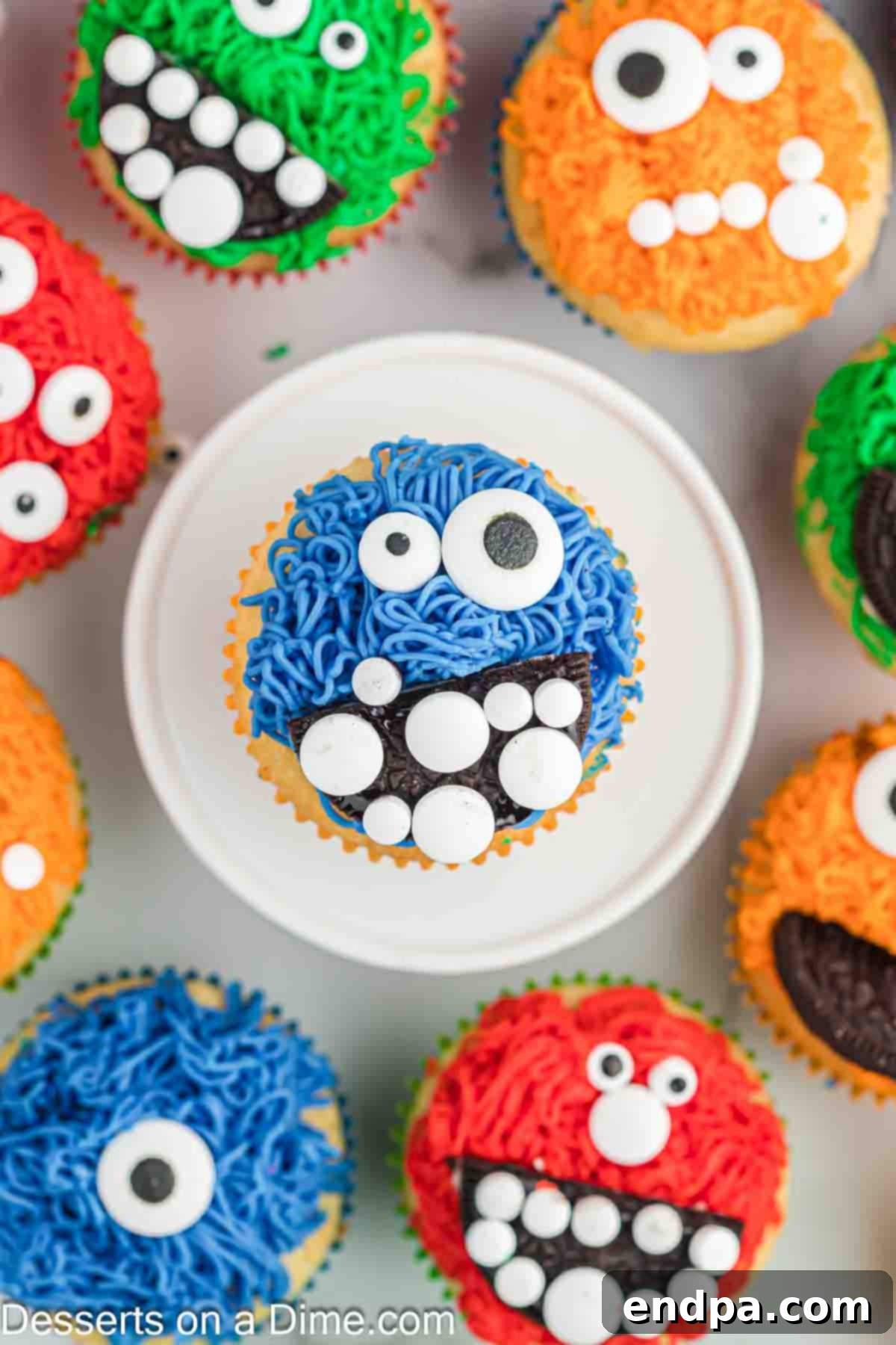 Spooktacular Monster Cupcakes 11 Monster Cupcakes arranged together and ready to serve.