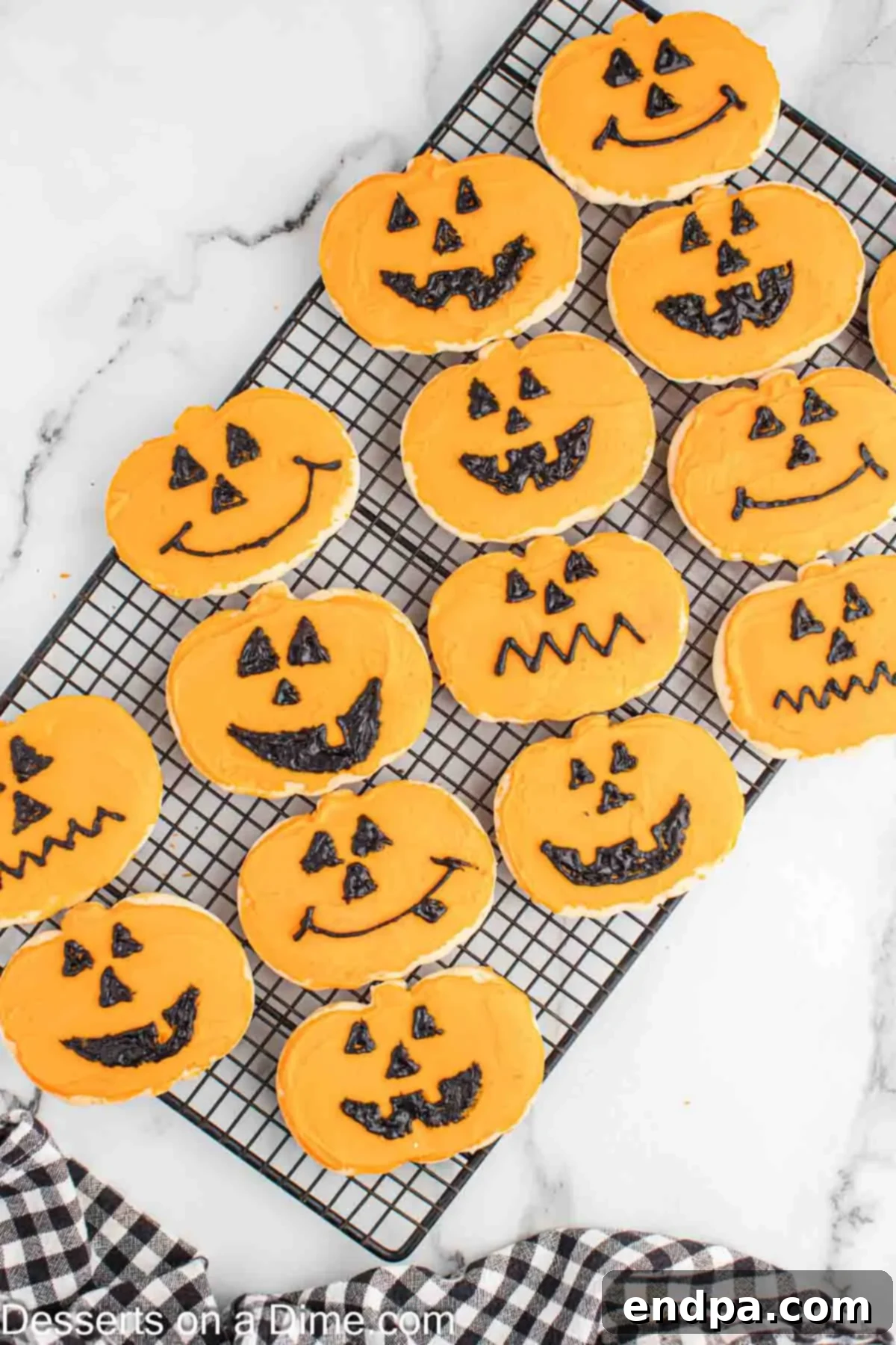 Frightfully Delicious Halloween Cookies 13 Decorated Halloween sugar cookies with jack-o'-lantern faces, ready to serve.