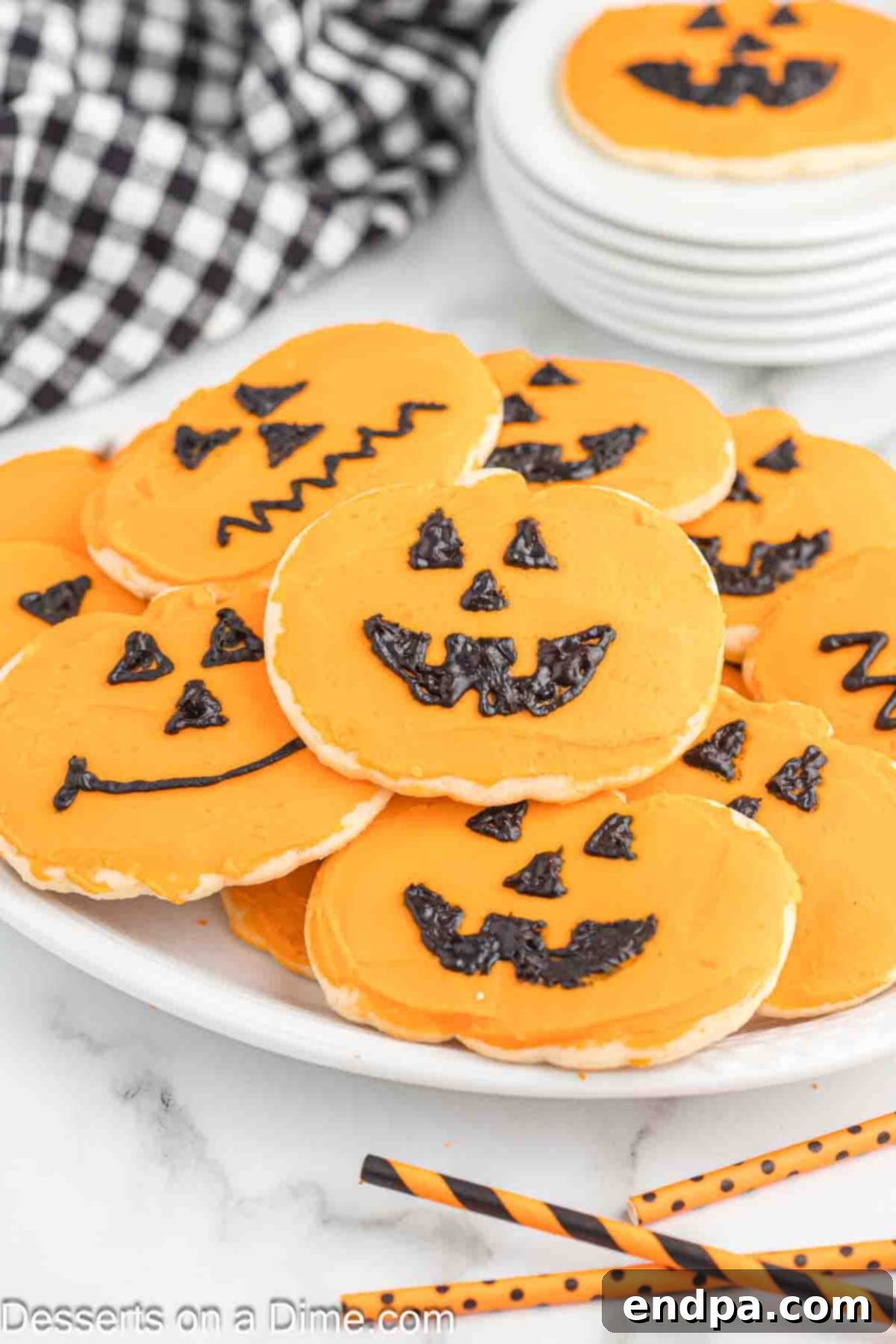 Frightfully Delicious Halloween Cookies 14 A festive plate of Halloween sugar cookies decorated with spooky designs.