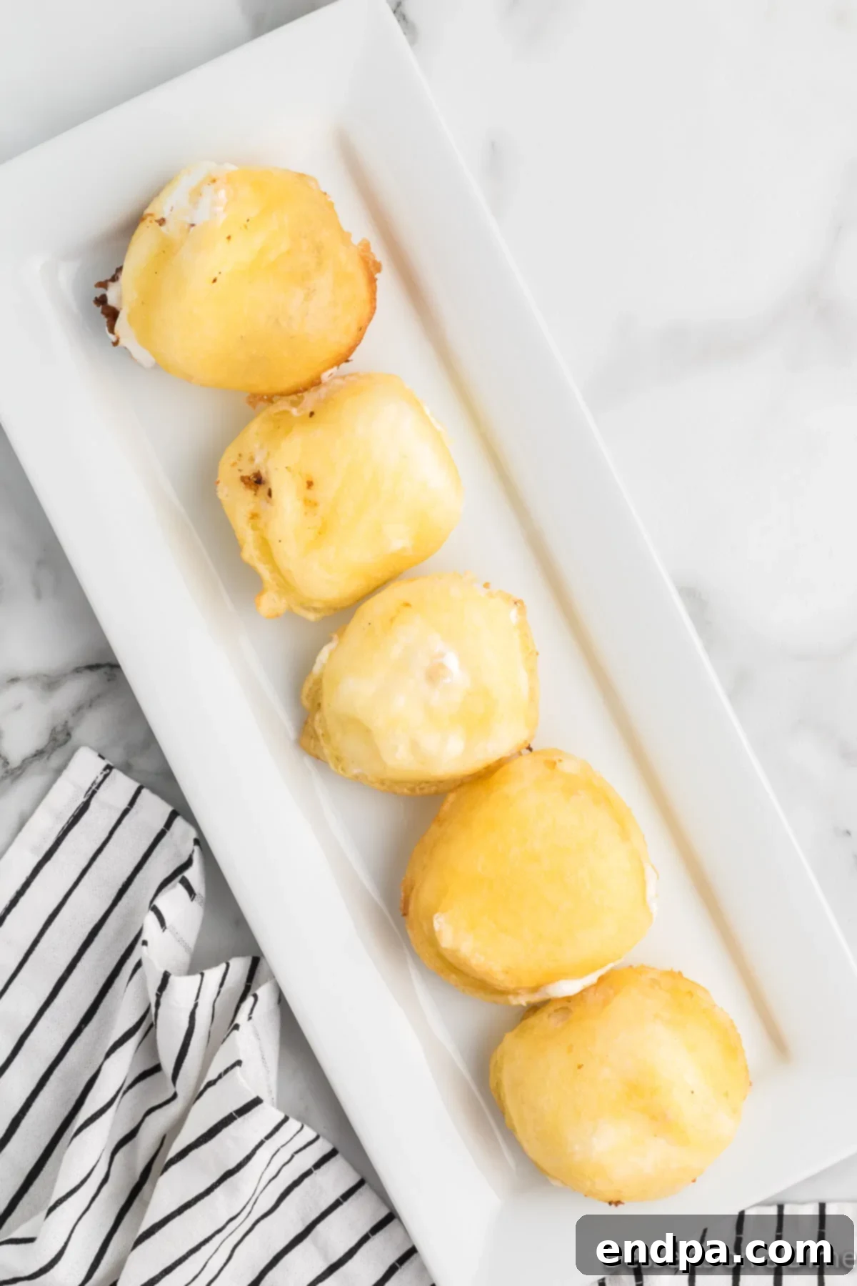 Fried marshmallows on serving tray. 
