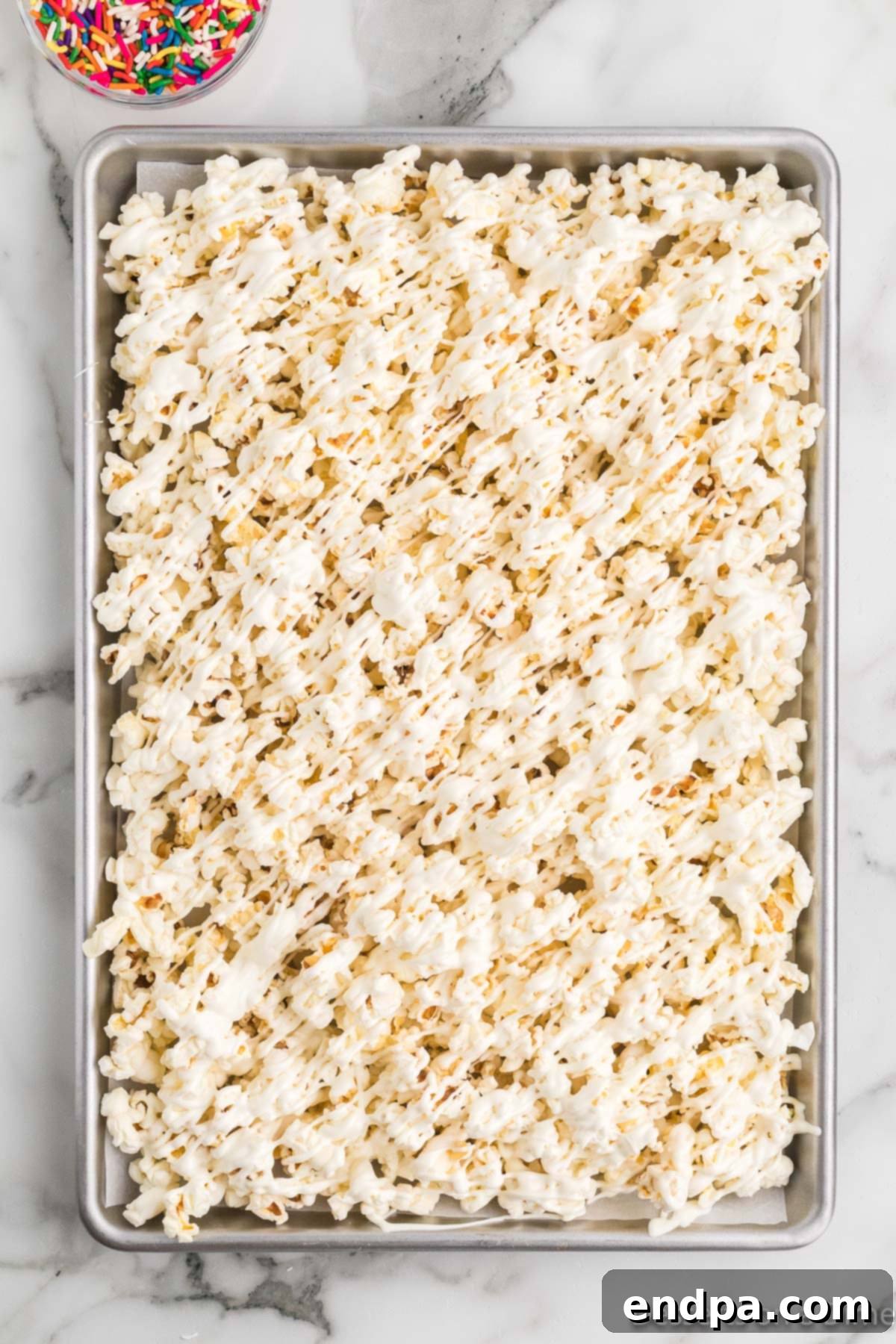 Bakery Sweet Popcorn 8 Melted white chocolate poured over the popcorn.