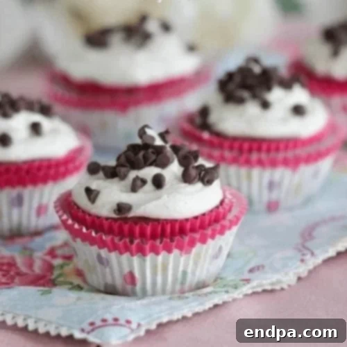 Decadent Pumpkin Brownie Cupcakes with a creamy swirl of frosting.