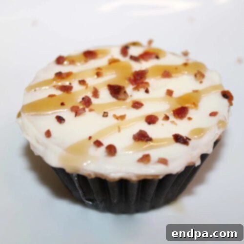 Sweet and savory Maple Bacon Pecan Cupcakes with fluffy frosting.