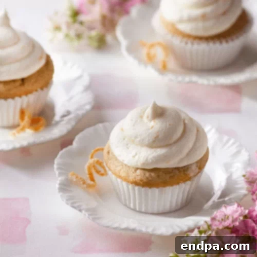 Elegant Lady Grey Cupcakes with a bright orange zest frosting.