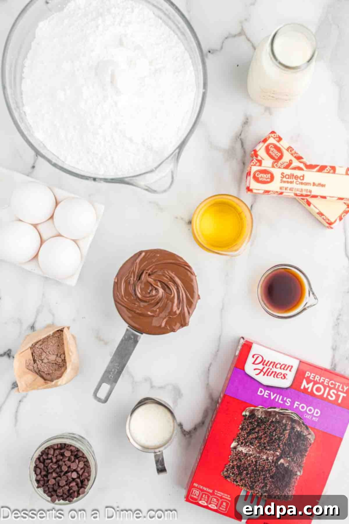 Ingredients for cupcakes and frosting - pudding mix, butter, cake mix, vanilla, powdered sugar, mini chocolate chips.