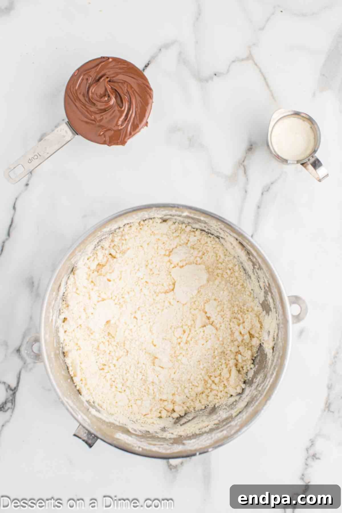 Powdered sugar added to butter mixture.