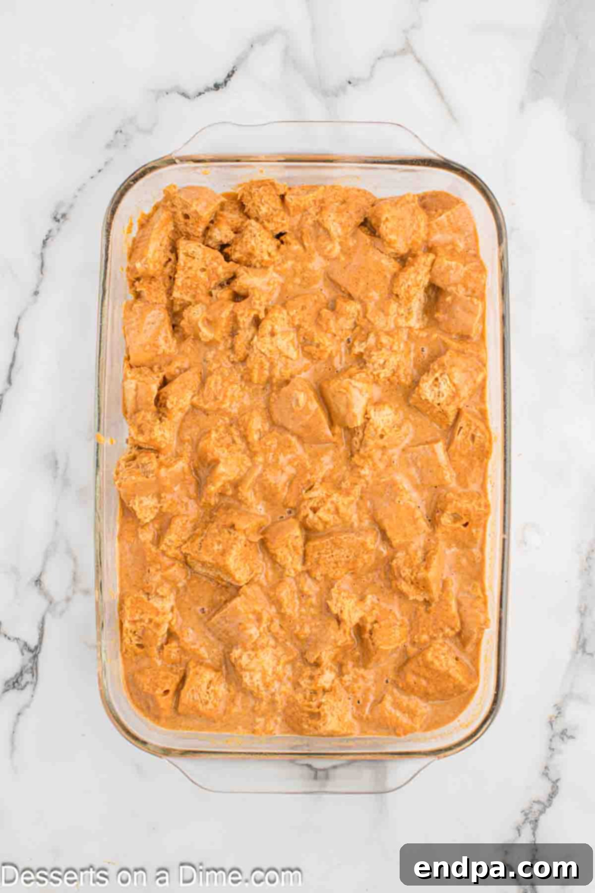 Bread mixture spread in baking dish. 
