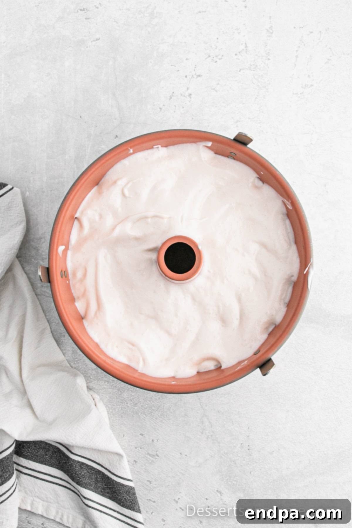 Cake batter poured into an ungreased tube pan, ready for baking.