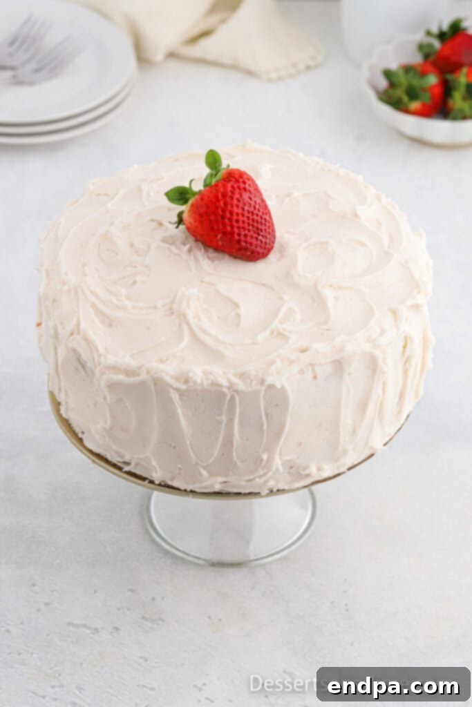 Paula Deen's Signature Strawberry Cake 11 A two-layer strawberry cake expertly frosted with cream cheese frosting, with frosting between the layers and covering the top and sides.