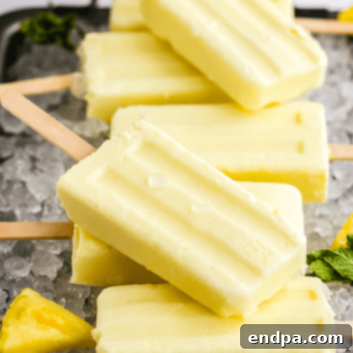 Refreshing Dole Whip Popsicles, a healthy and kid-friendly frozen treat.