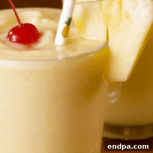 A glass of refreshing Dole Whip Lemonade, a frozen, dairy-free tropical drink.