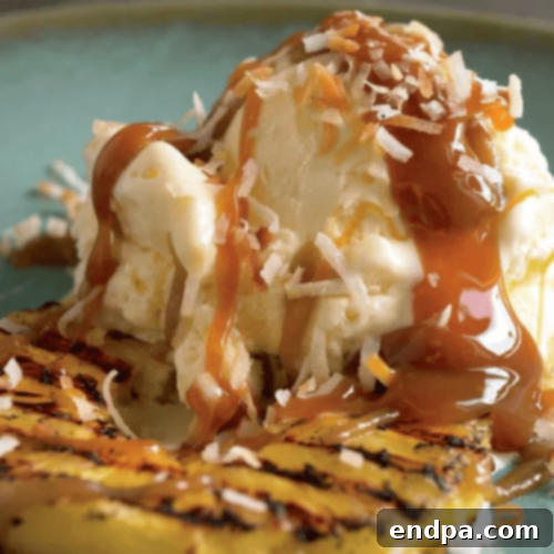 A scoop of vanilla ice cream topped with sweet, caramelized grilled pineapple and a rich rum sauce.