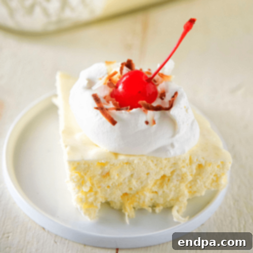 A refreshing Pina Colada Jello Salad, cool, creamy, and with a tropical flair.