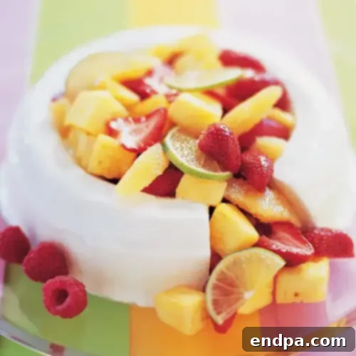 A light and airy Pina Colada Mousse, garnished with fresh pineapple and coconut.