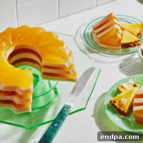 A beautifully layered Pina Colada Gelatin Dessert, showcasing tropical colors and textures.