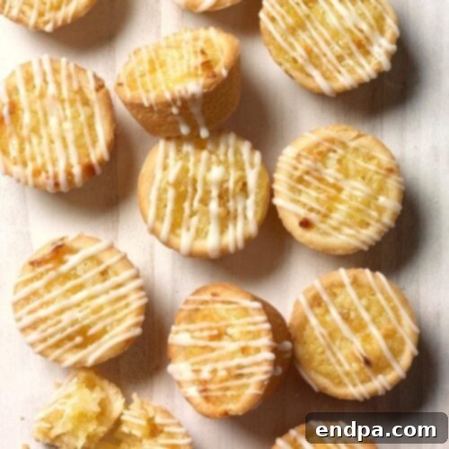 Delicate Pineapple Coconut Tassies, small pastry cups filled with a sweet tropical filling.