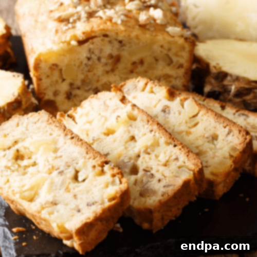 A moist Pineapple Macadamia Nut Cake, rich with tropical flavors and crunchy nuts.