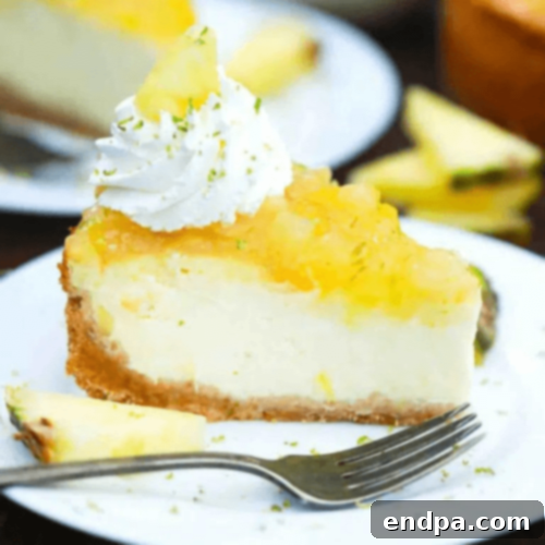 A decadent Pineapple Cheesecake with a generous layer of fresh pineapple topping.