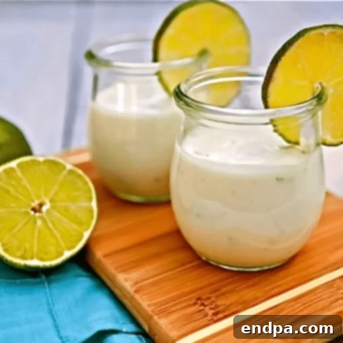 The Ultimate Collection of Tangy Lime Desserts 14 Small glass cups filled with white chocolate lime pudding, garnished with lime zest.