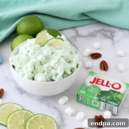 The Ultimate Collection of Tangy Lime Desserts 46 Green lime fluff dessert with cream cheese and pineapple chunks.