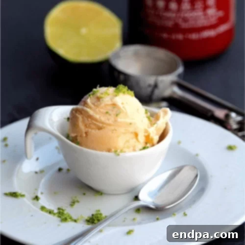 The Ultimate Collection of Tangy Lime Desserts 56 Scoops of sriracha lime ice cream in a bowl, garnished with lime and chili.
