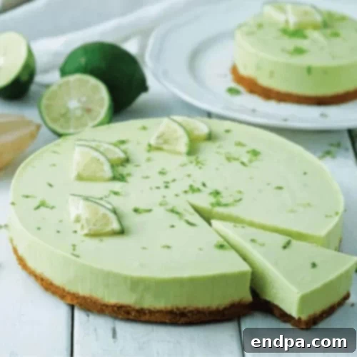 The Ultimate Collection of Tangy Lime Desserts 57 No-bake avocado lime cheesecake slice with a vibrant green filling and cookie crust.