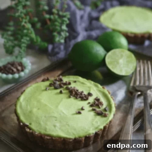 The Ultimate Collection of Tangy Lime Desserts 3 Green no-bake lime avocado tart topped with fresh berries.