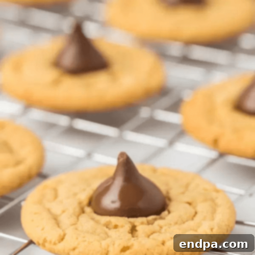 Gluten-Free Peanut Butter Kiss Cookies with a chocolate kiss in the center.