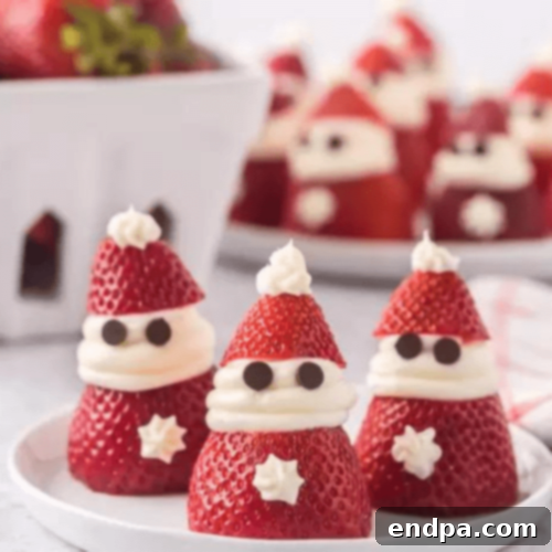 Adorable Strawberry Santas with whipped cream beards.