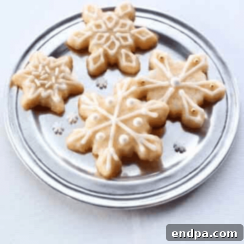 Delicate Snowflake Eggnog Cookies, perfectly shaped and decorated.