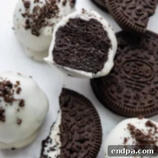 Decadent Gluten Free Oreo Truffles, covered in chocolate.