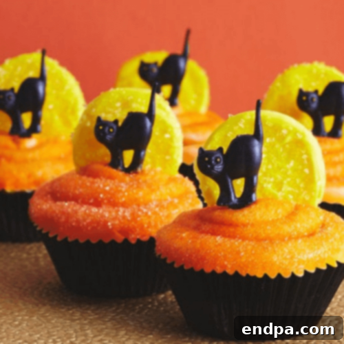 Elegant Cat and Moon Cupcakes featuring black cat silhouettes against a shimmering moon backdrop.