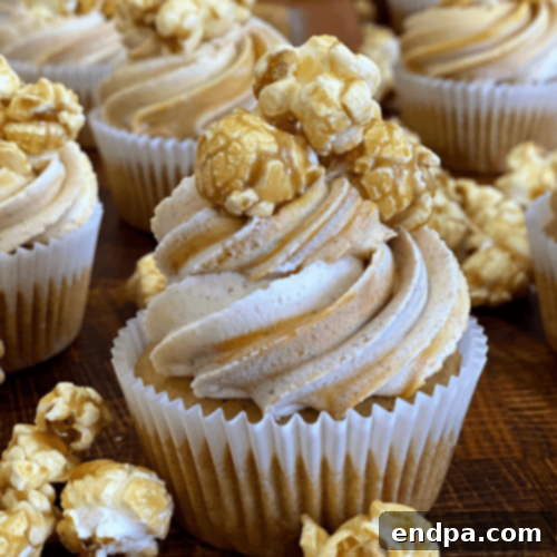 Autumnal Caramel Corn Cupcakes topped with a light caramel buttercream and crunchy caramel popcorn.
