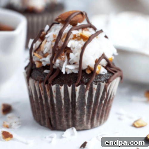 Decadent Almond Joy Cupcakes featuring chocolate cake, coconut frosting, and an almond topping.