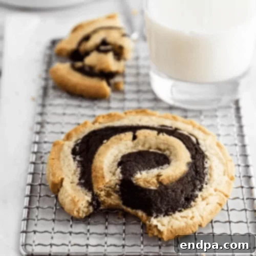 Peanut butter brownie swirl cookies on a plate.