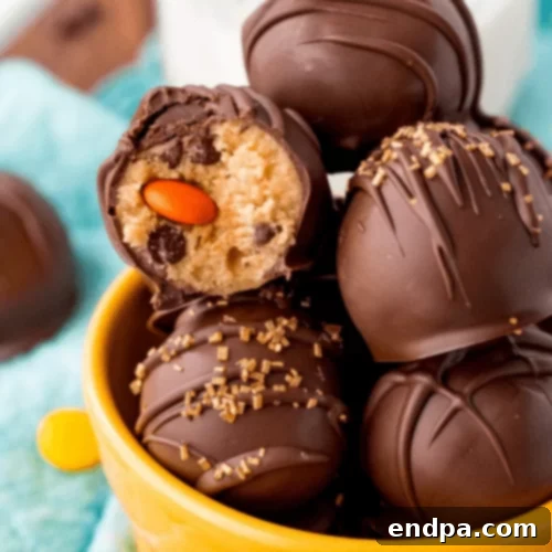 Peanut butter cookie dough truffles with chocolate drizzle.