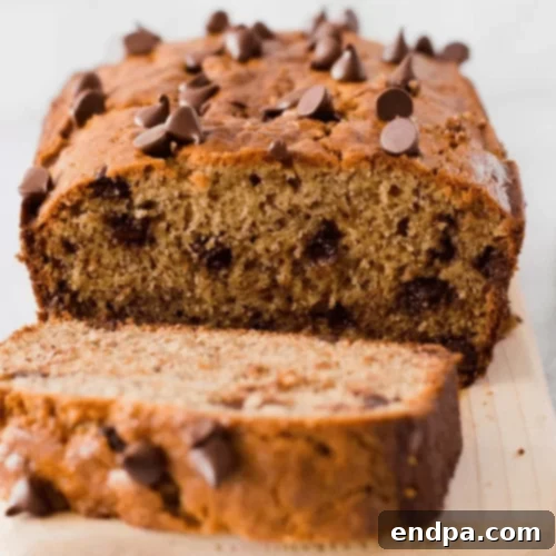A slice of peanut butter chocolate chip banana bread.