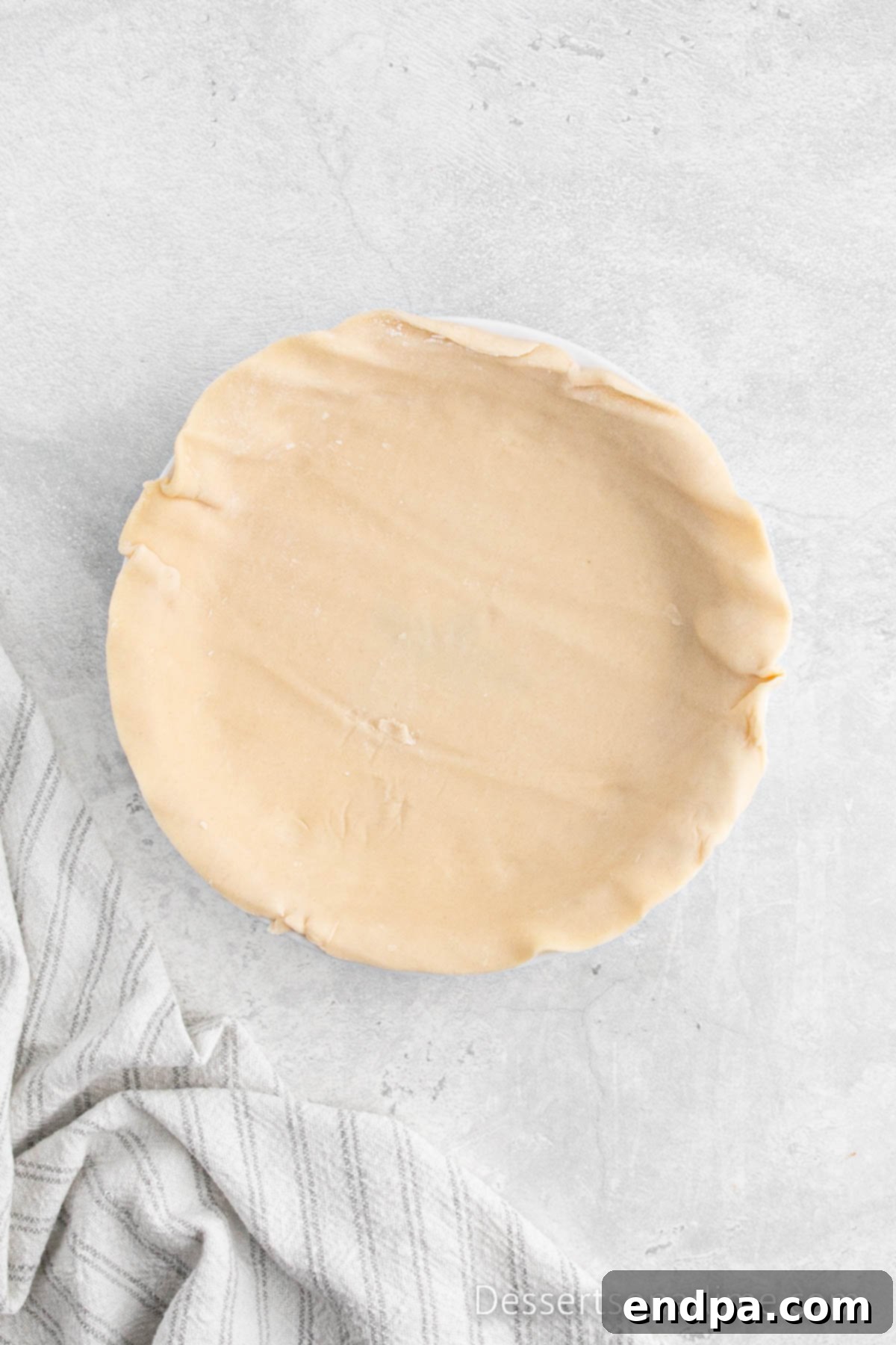 Traditional Christmas Mincemeat Pie 4 Pie crust gently placed into a pie plate, ready for filling.