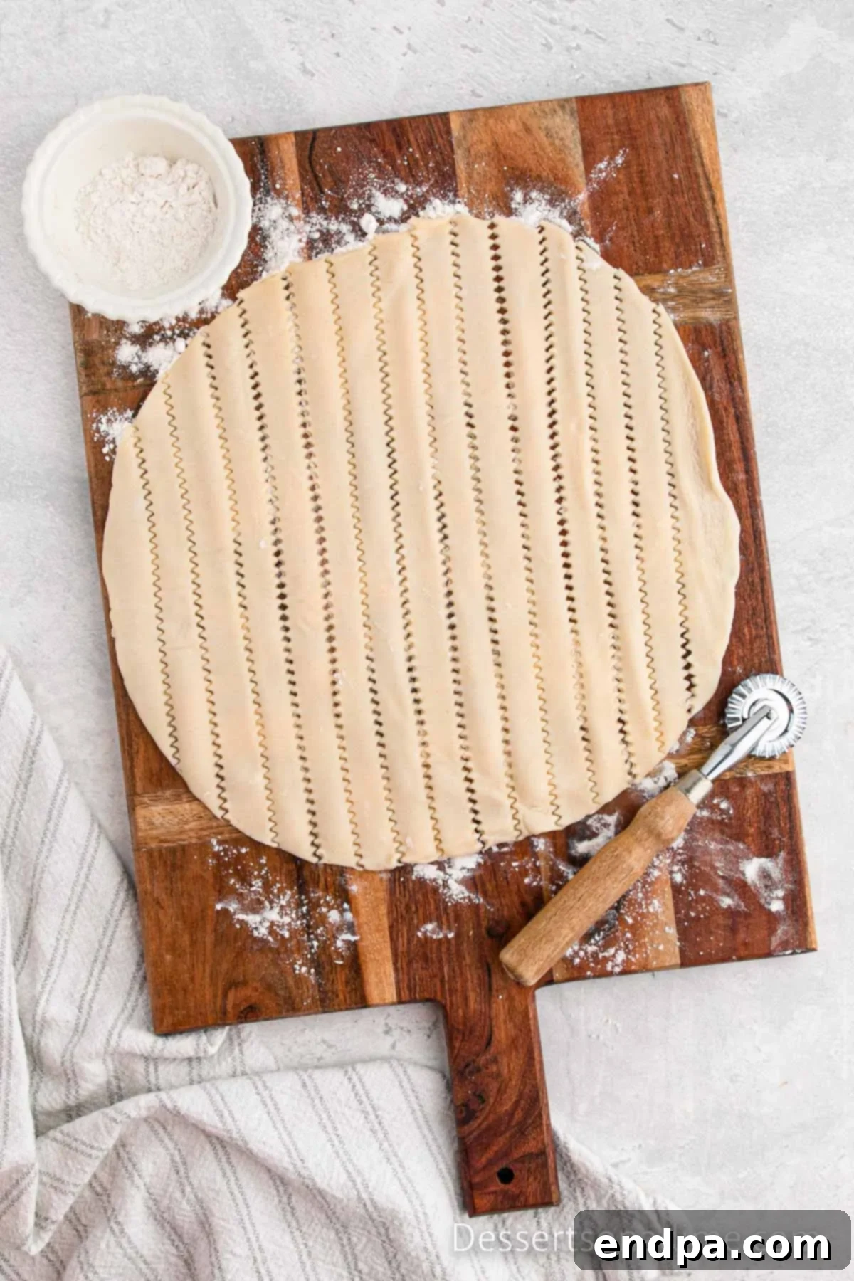 Traditional Christmas Mincemeat Pie 6 Cutting the second pie crust into strips to create a lattice top.