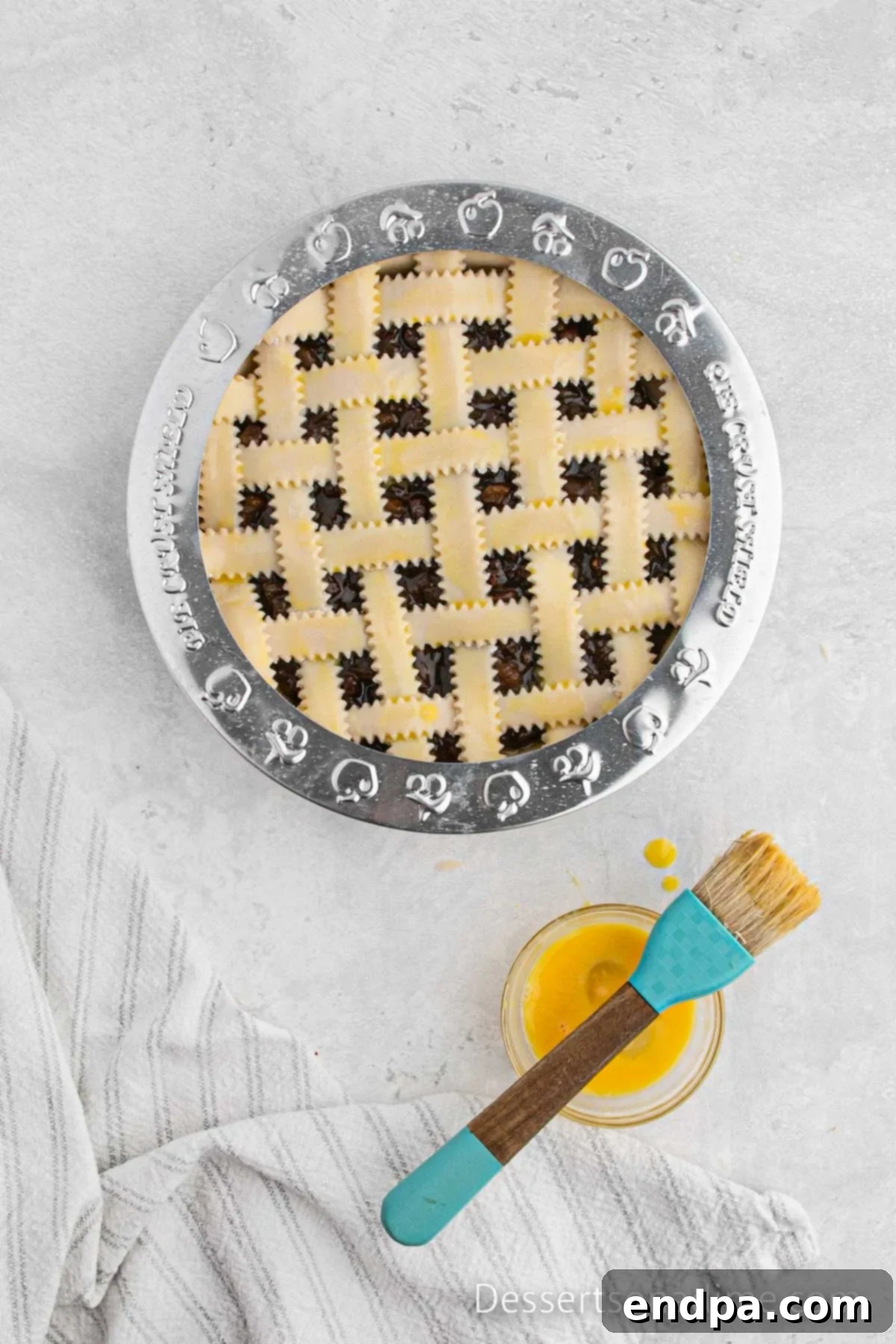 Traditional Christmas Mincemeat Pie 9 The mincemeat pie covered with a pie crust shield, ready for baking.